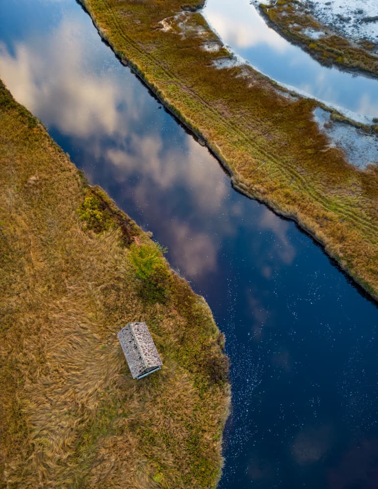 Remote River Cabin by Ambar Saha — canvas wall art
