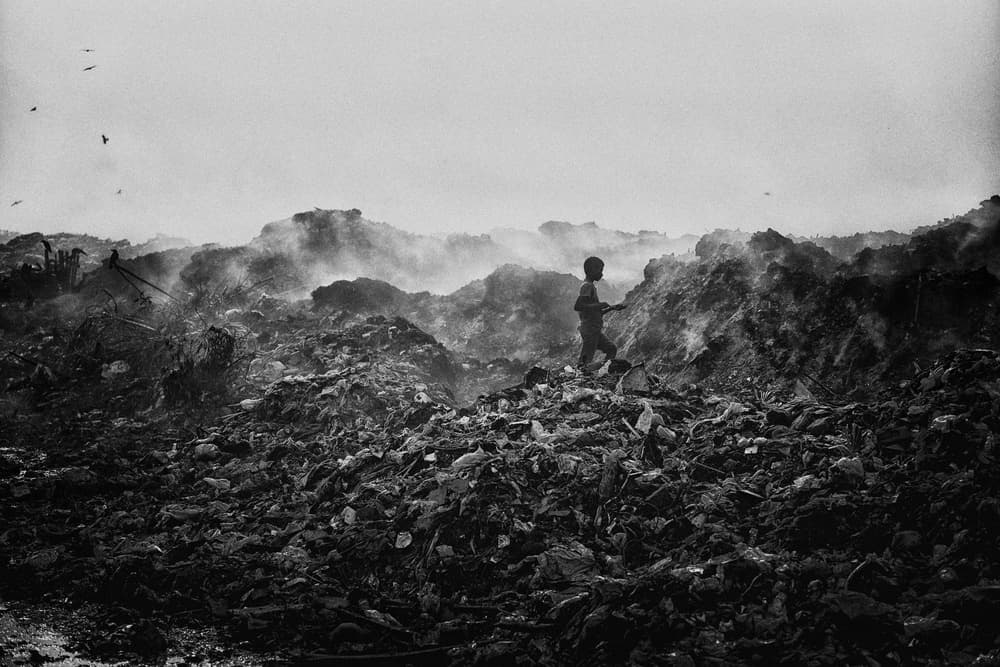 Child Amidst Waste by Avishek Das — canvas wall art