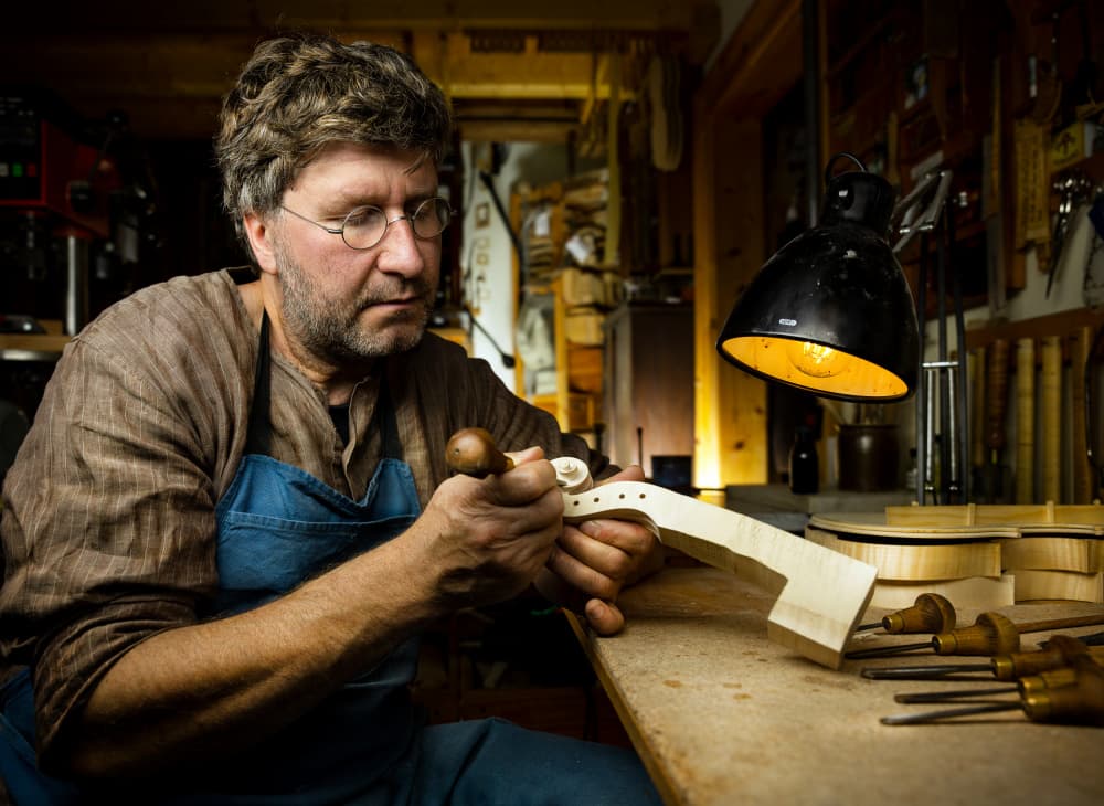 Craftsman Making Instrument by Michael Allmaier — canvas wall art