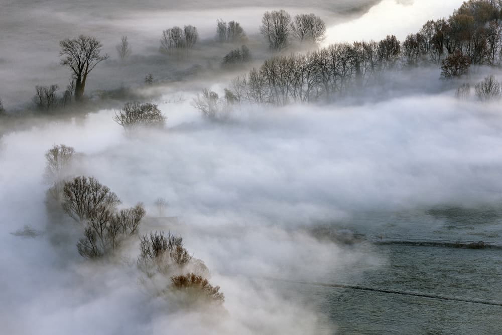 Misty Winter Valley by Fabrizio Daminelli — canvas wall art
