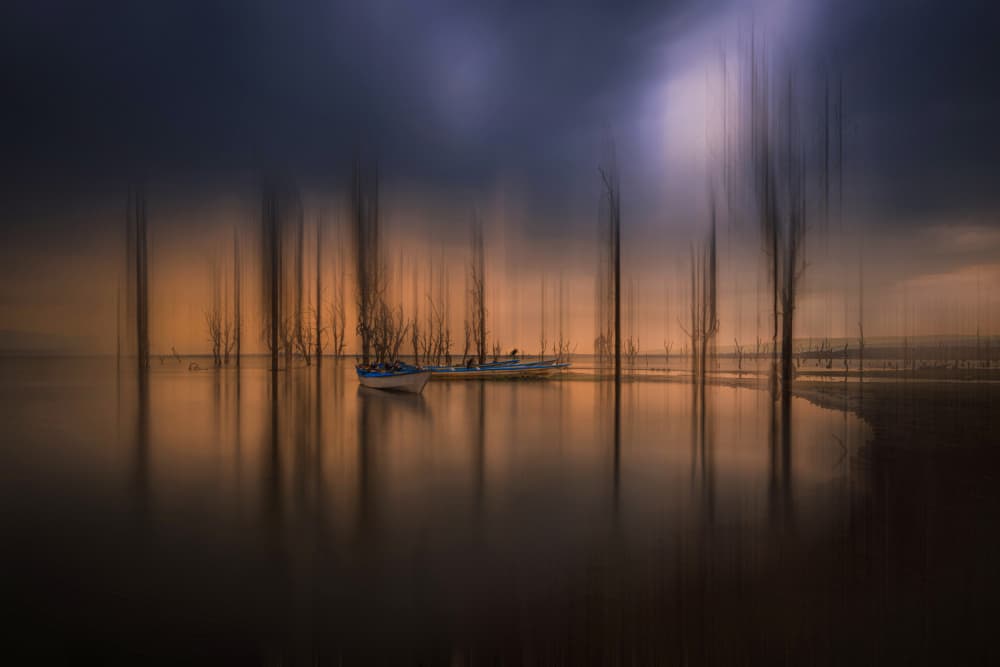 Moody Lake Reflections by Isam Telhami — canvas wall art