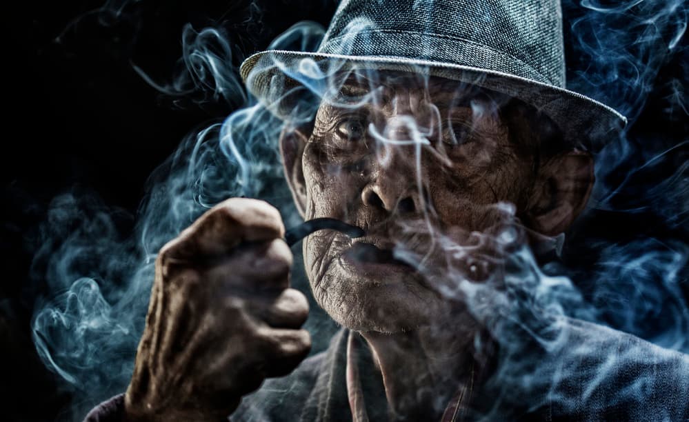 Contemplative Pipe Smoker by Andi Halil — canvas wall art