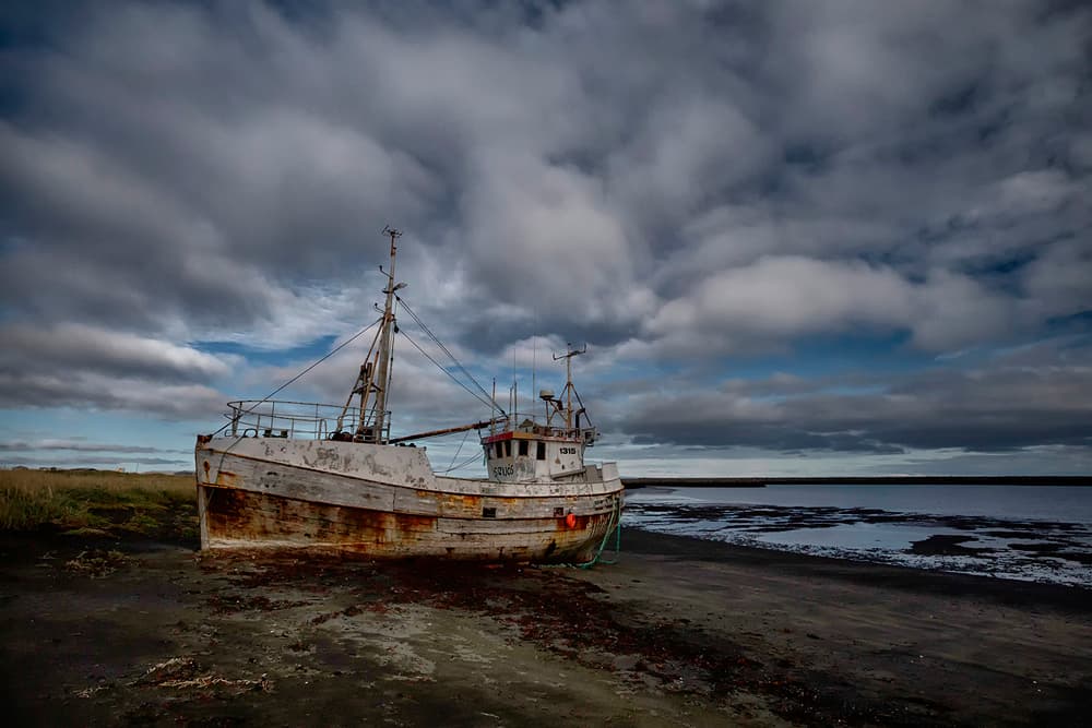 Abandoned Fishing Boat Beach by Þorsteinn H. Ingibergsson — canvas wall art