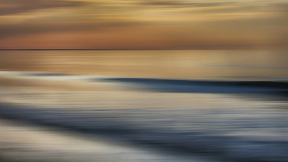 Blurred Ocean Sunset by Benjamine Hullot Scalvenzi — canvas wall art