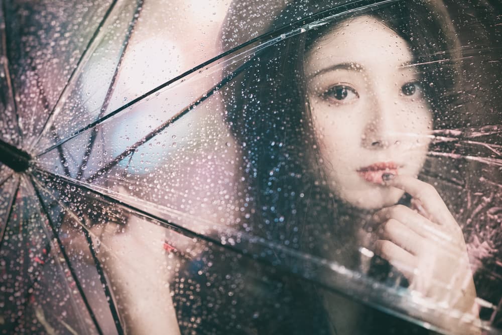 Woman Through Rainy Umbrella by Daisuke Kiyota — canvas wall art