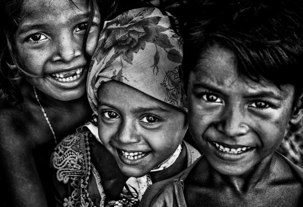 Smiling Children's Faces by Joxe Inazio Kuesta Garmendia — canvas wall art