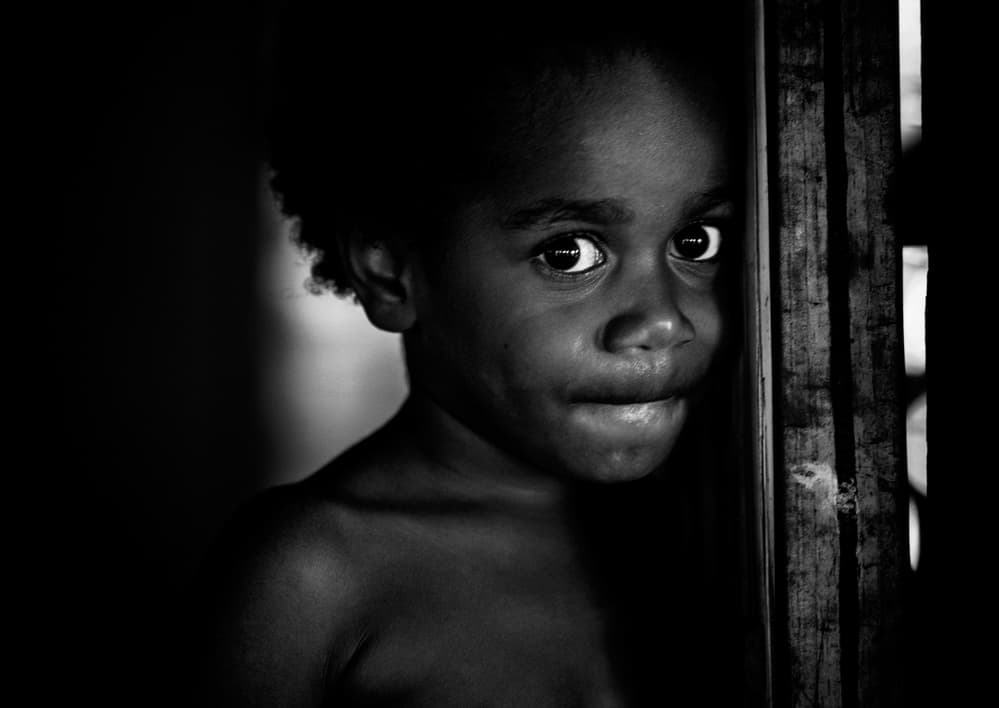 Shy Child Peeking by Joxe Inazio Kuesta Garmendia — canvas wall art