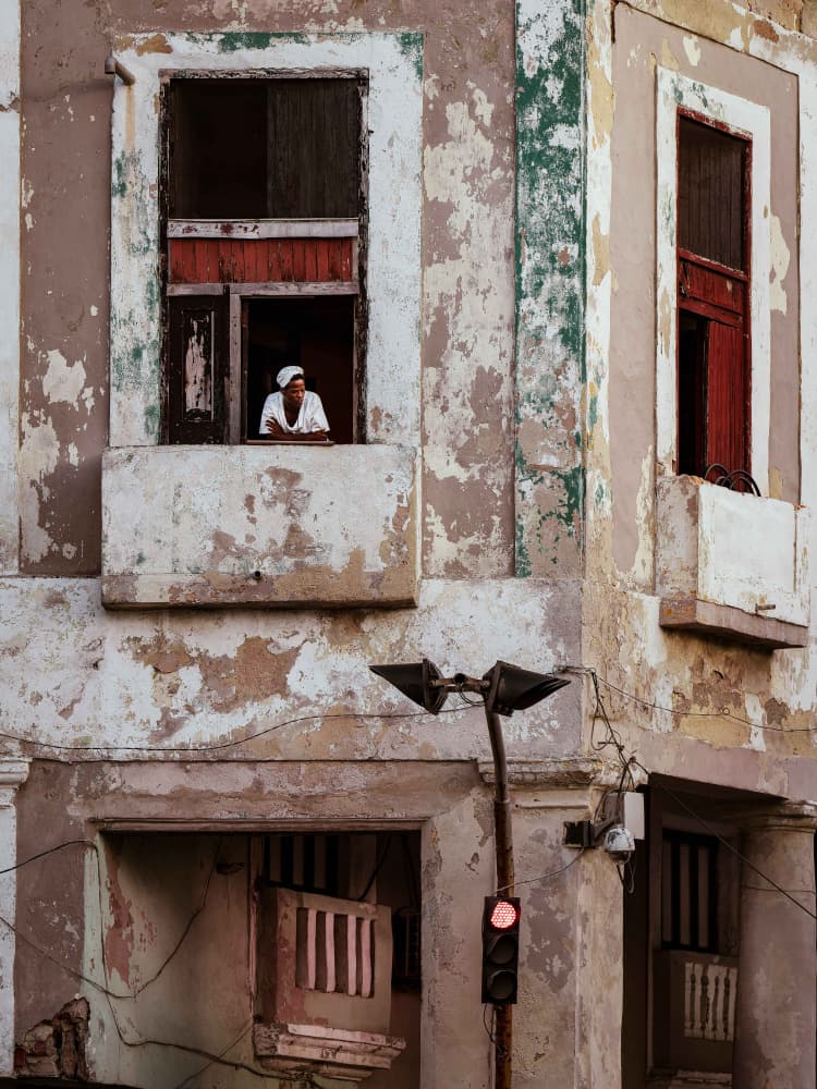 Woman in Old City Window by Andy Bauer — canvas wall art