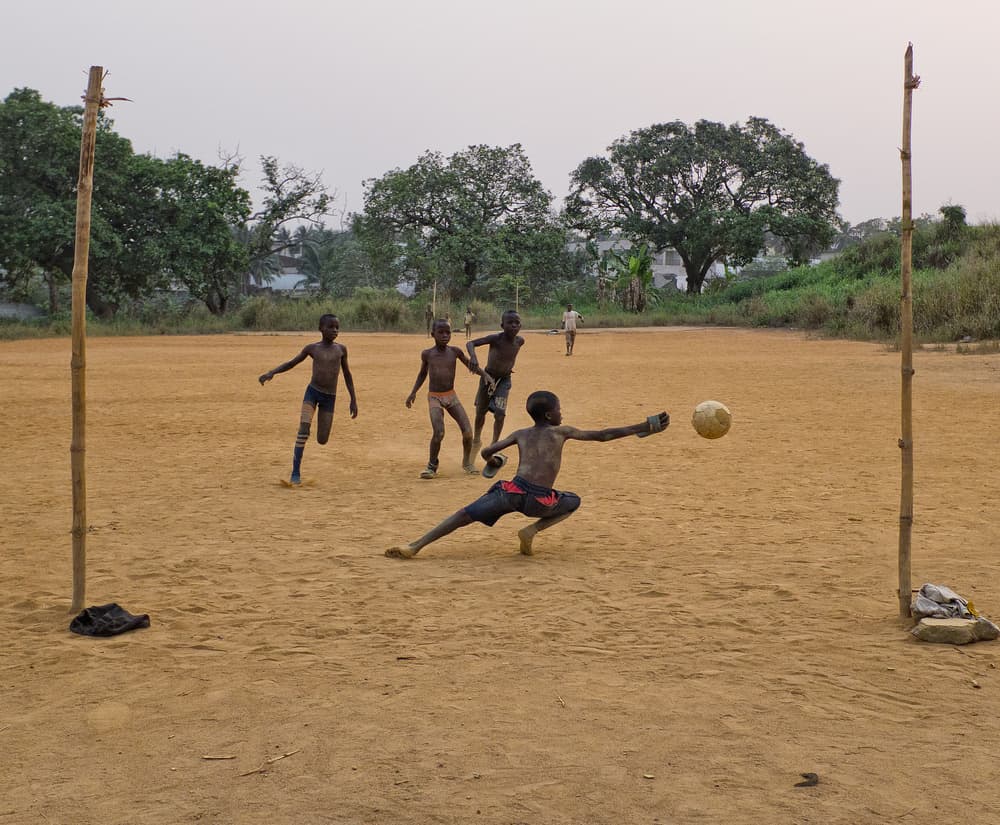 Kids Soccer Game by Lorenzo Grifantini — canvas wall art