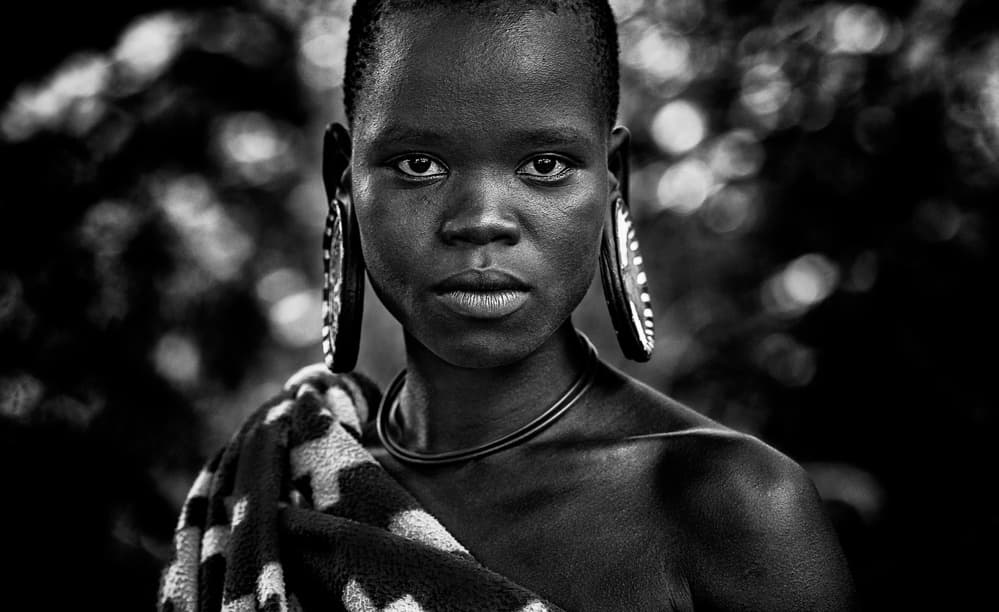 African Woman's Gaze by Joxe Inazio Kuesta Garmendia — canvas wall art