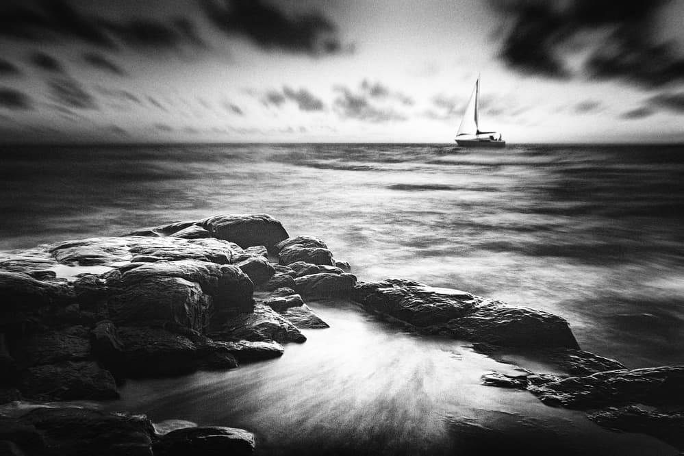 Sailboat Over Rocky Coast by Gustav Davidsson — canvas wall art