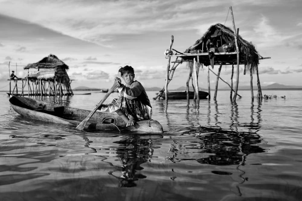 Young Paddler's Village by Kieron Long — canvas wall art