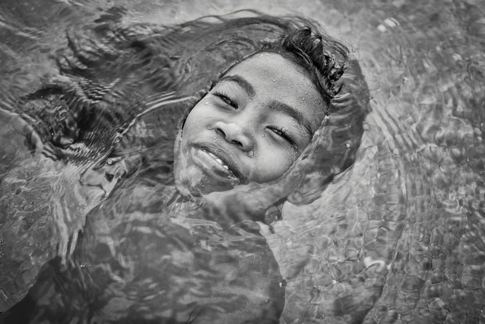 Floating Child's Smile by Gloria Salgado Gispert — canvas wall art
