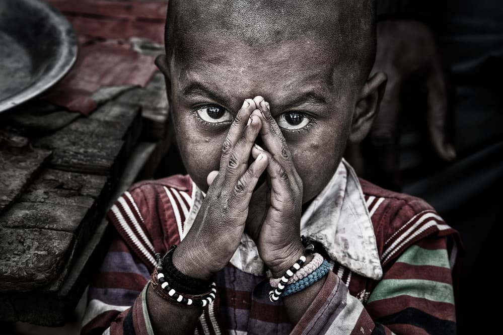 Child With Praying Hands by Joxe Inazio Kuesta Garmendia — canvas wall art