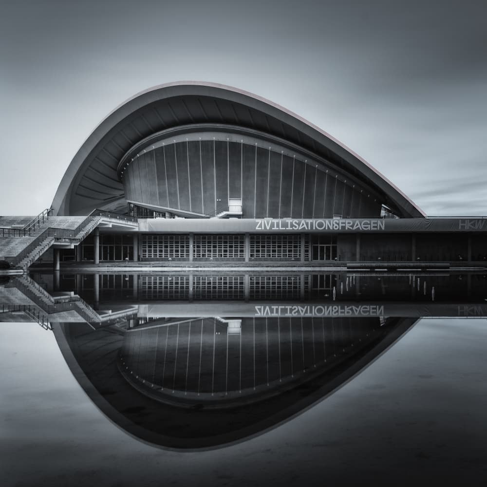 Curved Building Reflection by Rolf Lampert — canvas wall art