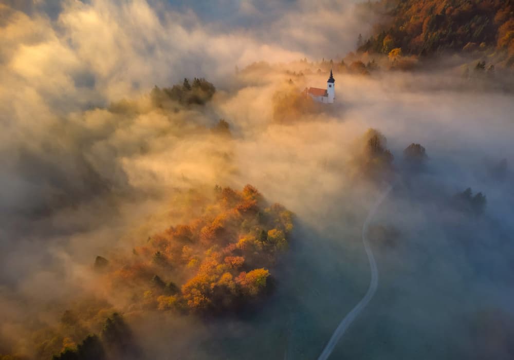 Misty Autumn Church by Ales Komovec — canvas wall art