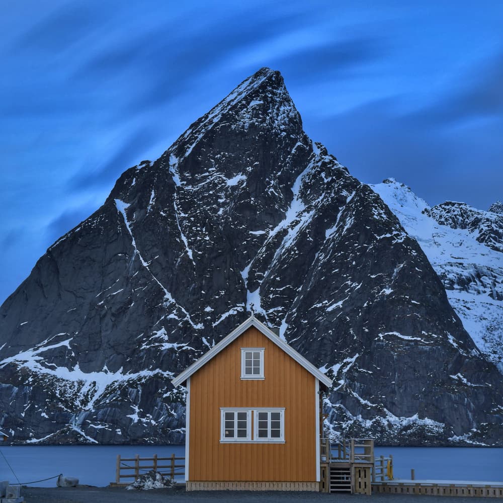 Orange House Snowy Mountain by Marc Pelissier — canvas wall art