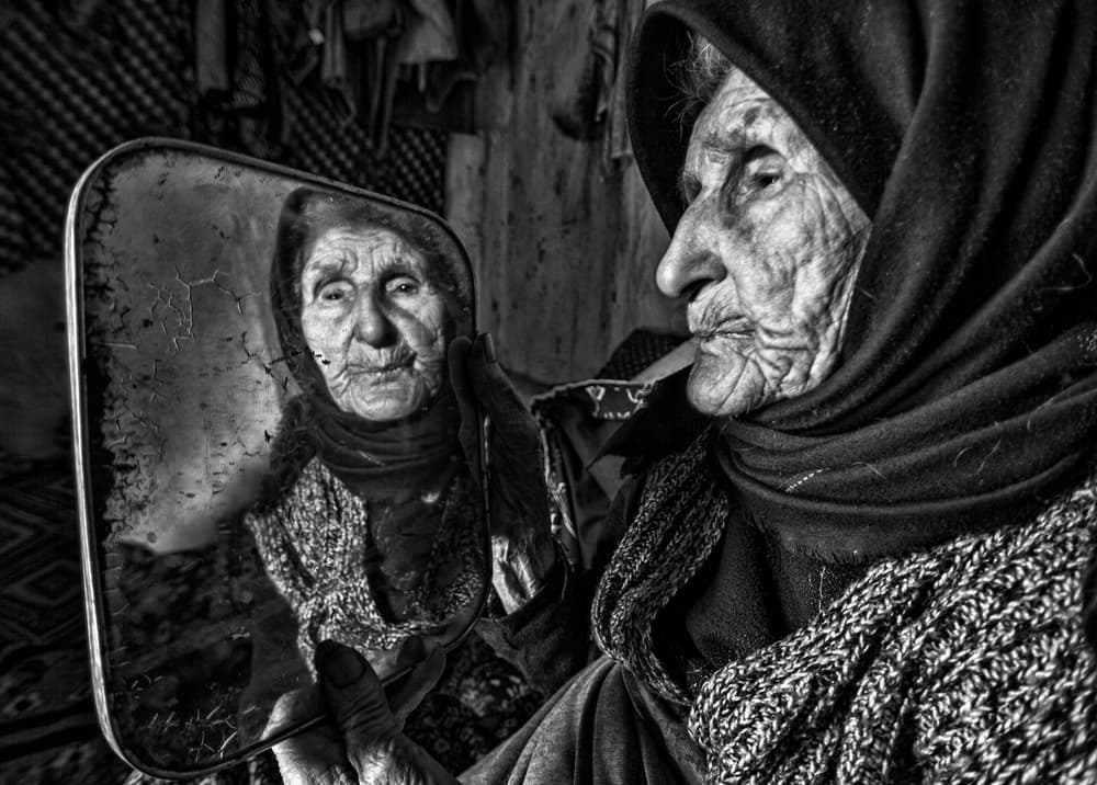 Aging Face in Mirror by Feyzullah Tunç — canvas wall art