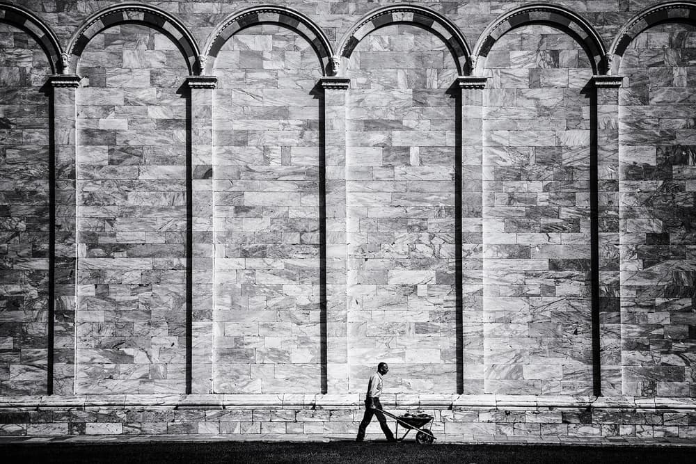 Worker Against Arched Wall by Massimo Della Latta — canvas wall art