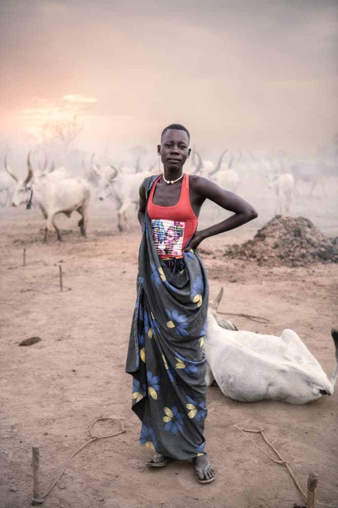 Mundari herds woman by Trevor Cole — canvas wall art