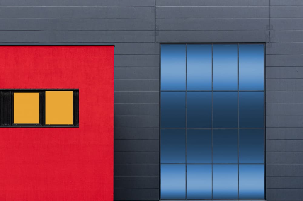 Red Wall Blue Windows by Roland M Schwerdtfeger — canvas wall art