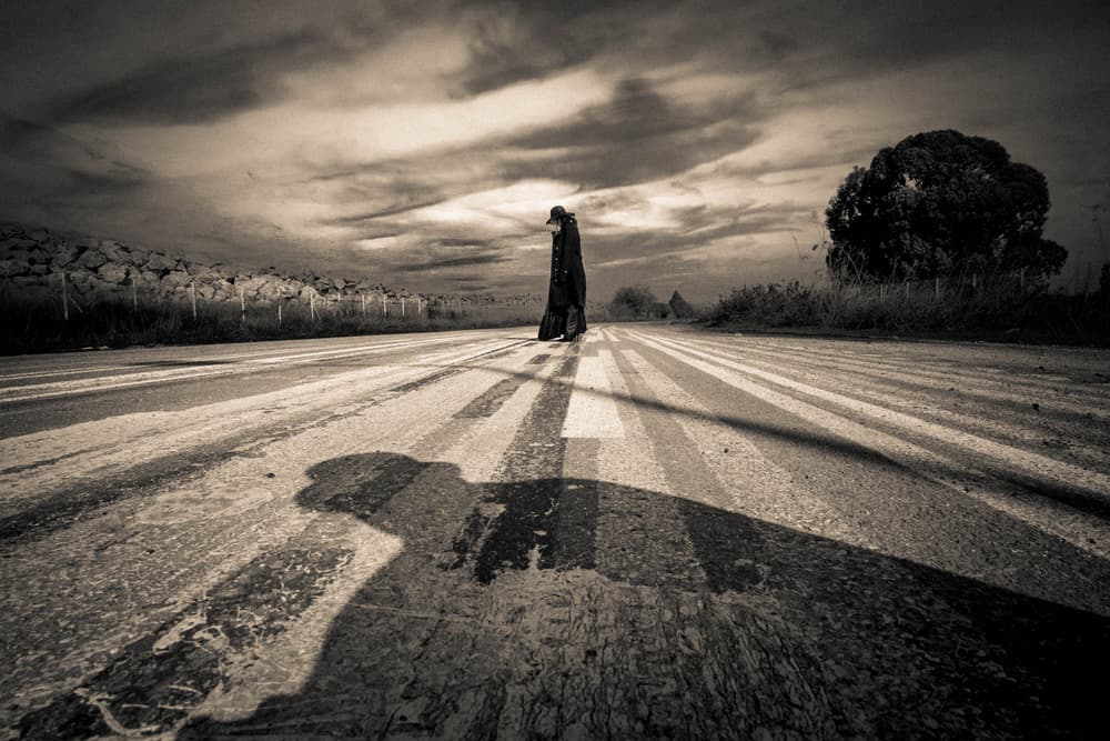 Lone Figure Long Shadow by Yuri Shepelev — canvas wall art
