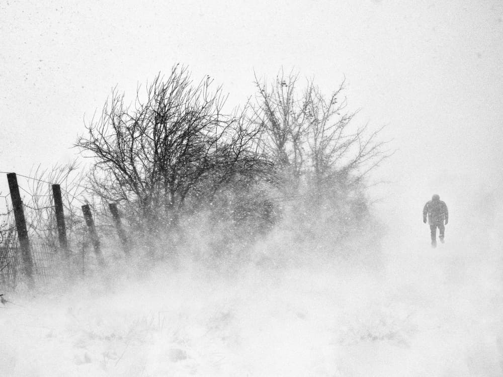 Man in Winter Blizzard by Marius Cinteza — canvas wall art