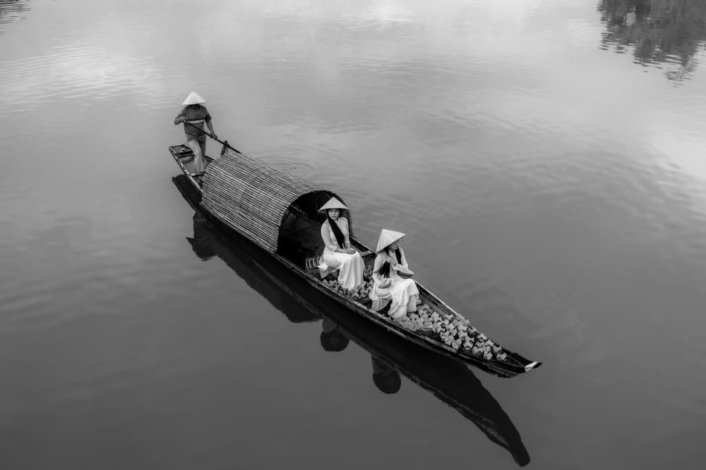 Serene Vietnamese Boat Ride by ADIREK M — canvas wall art