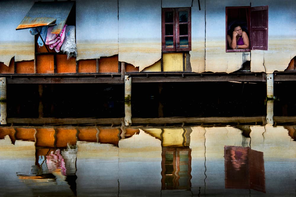 Woman In Window Reflection by Ekkachai Khemkum — canvas wall art