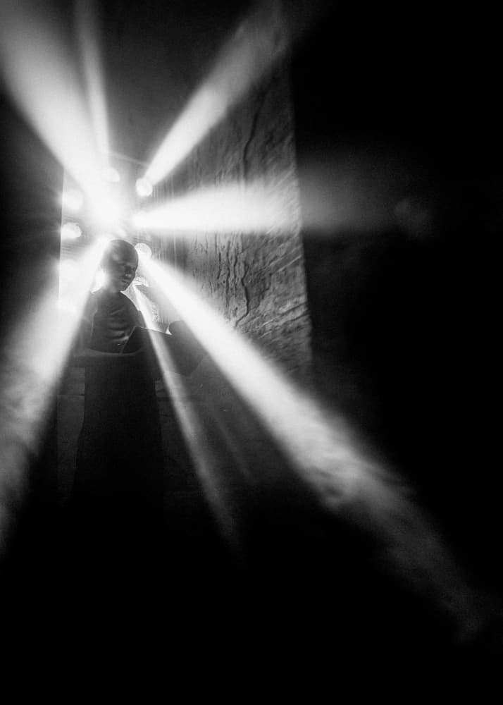 Monk in Light Rays by ADIREK M — canvas wall art