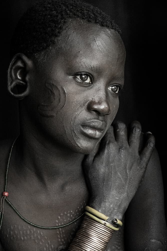 a penny for your thoughts... Suri girl at Omo valley by Elena Molina — canvas wall art