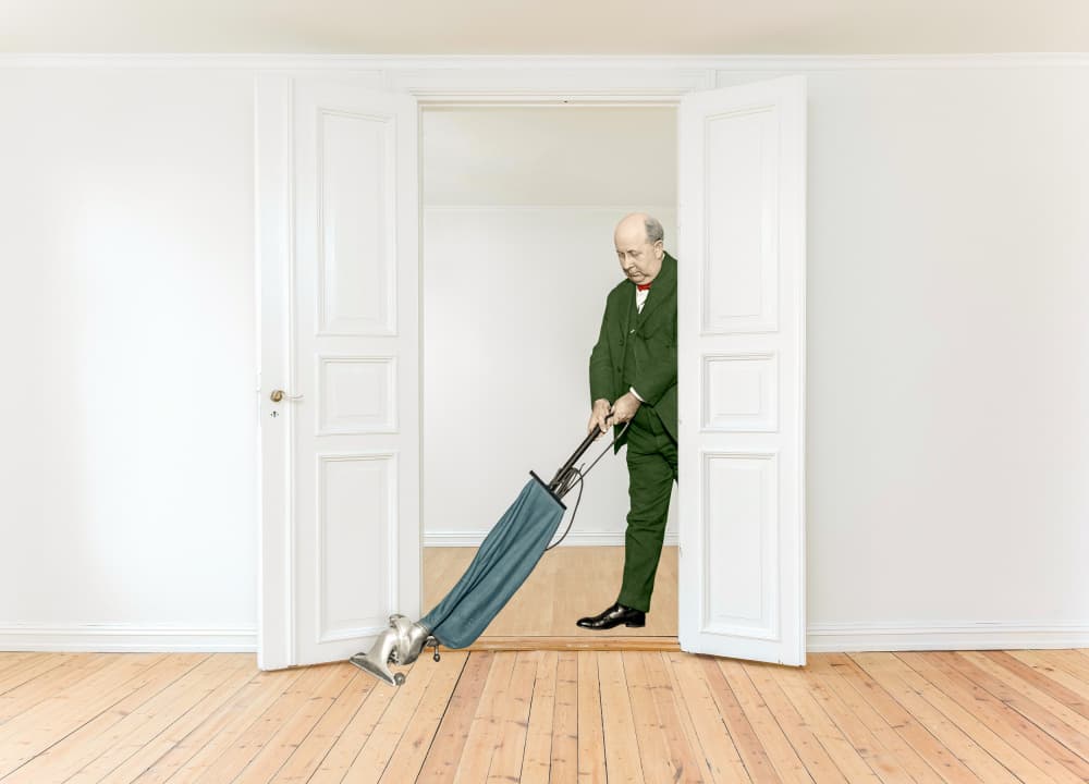 Man With Vintage Vacuum by Marja van den Hurk — canvas wall art
