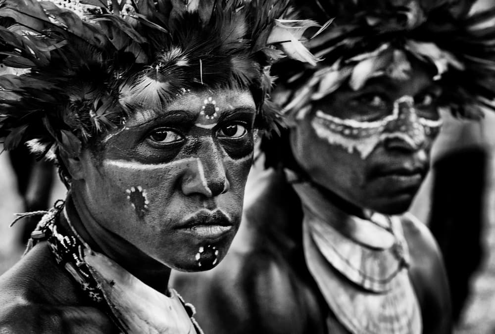 Tribal Men Painted Faces by Joxe Inazio Kuesta Garmendia — canvas wall art