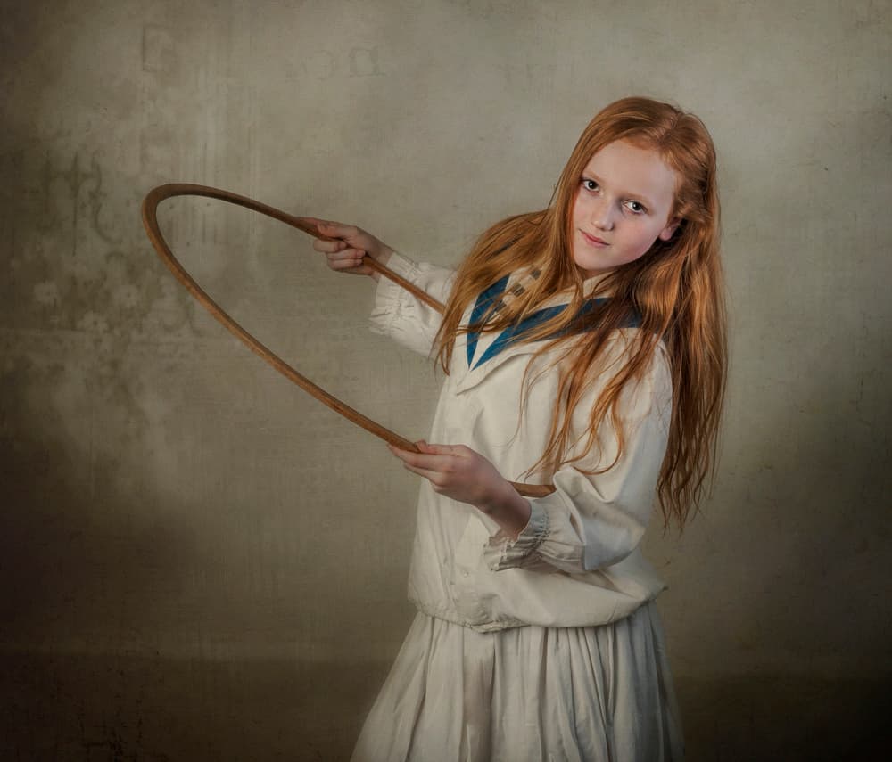 Girl With Wooden Hoop by Monika Vanhercke — canvas wall art