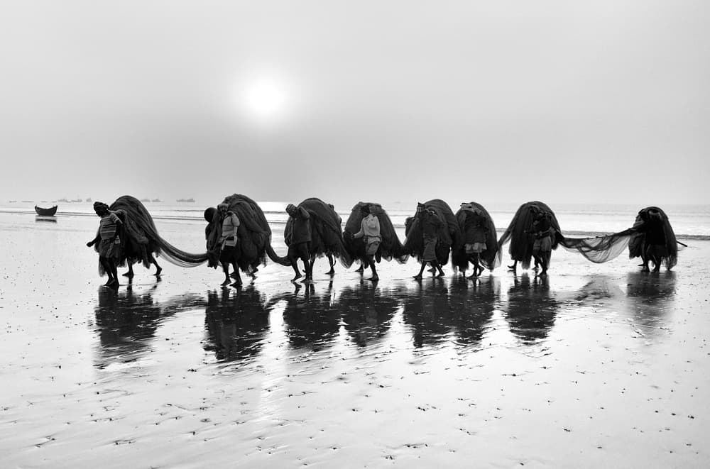 Fishermen Hauling Nets by Avishek Das — canvas wall art