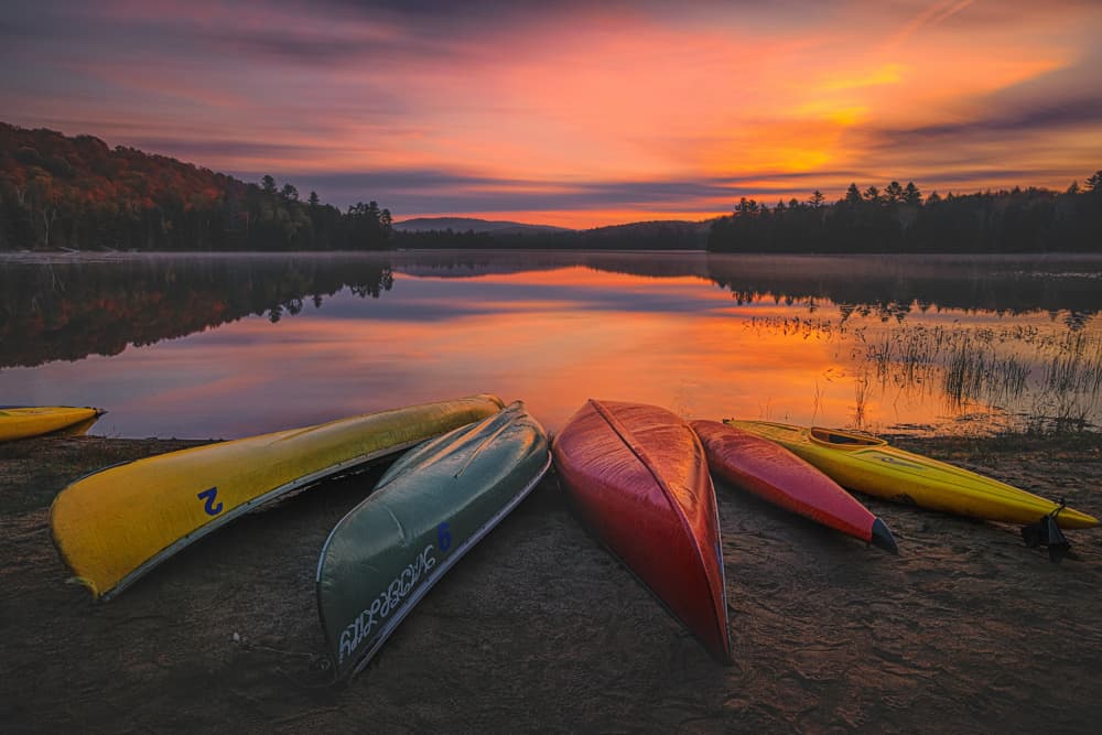 Sunset Lake Canoes by Lydia Jacobs — canvas wall art