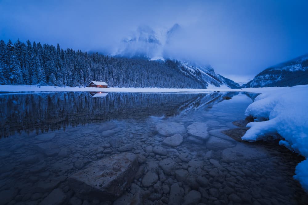 Winter Lake Cabin Reflection by Yongnan Li (李永男) — canvas wall art