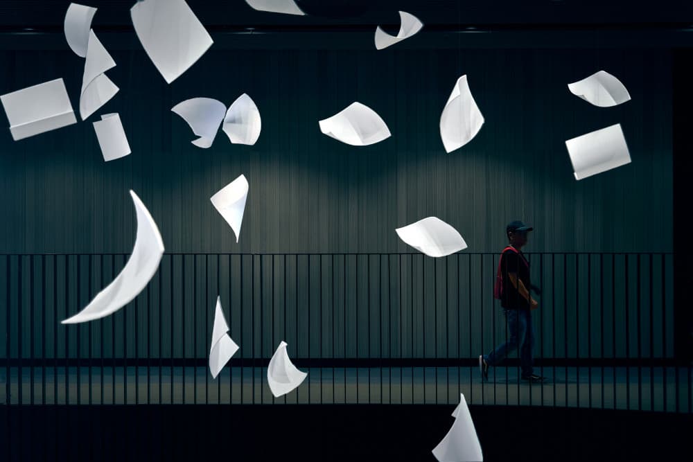 Man Among Floating Papers by MingLun Tsai (蔡明倫) — canvas wall art