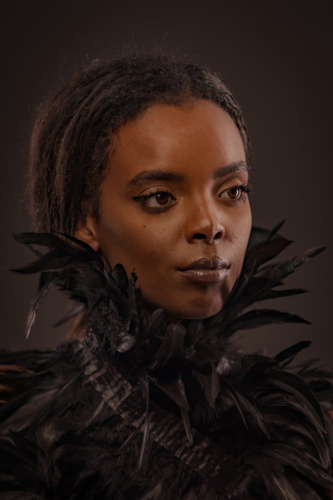 Woman In Black Feathers by Gila Koller — canvas wall art