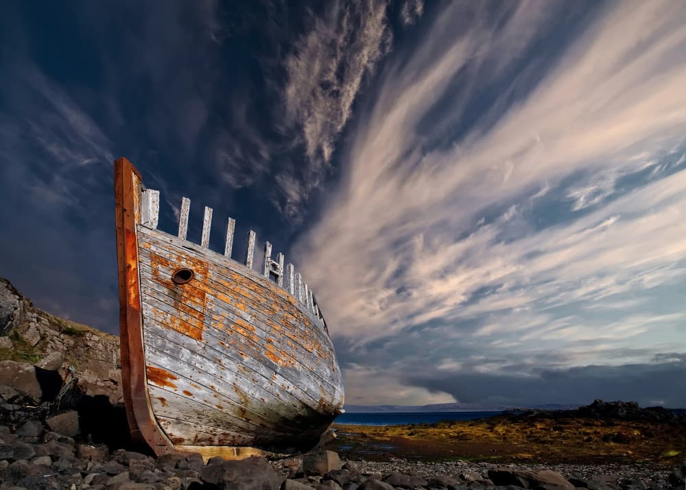 Weathered Boat Dramatic Sky by Þorsteinn H. Ingibergsson — canvas wall art