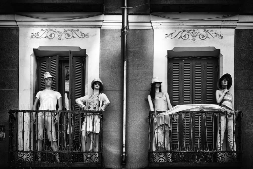 Mannequins On City Balcony by Roberto Marini — canvas wall art