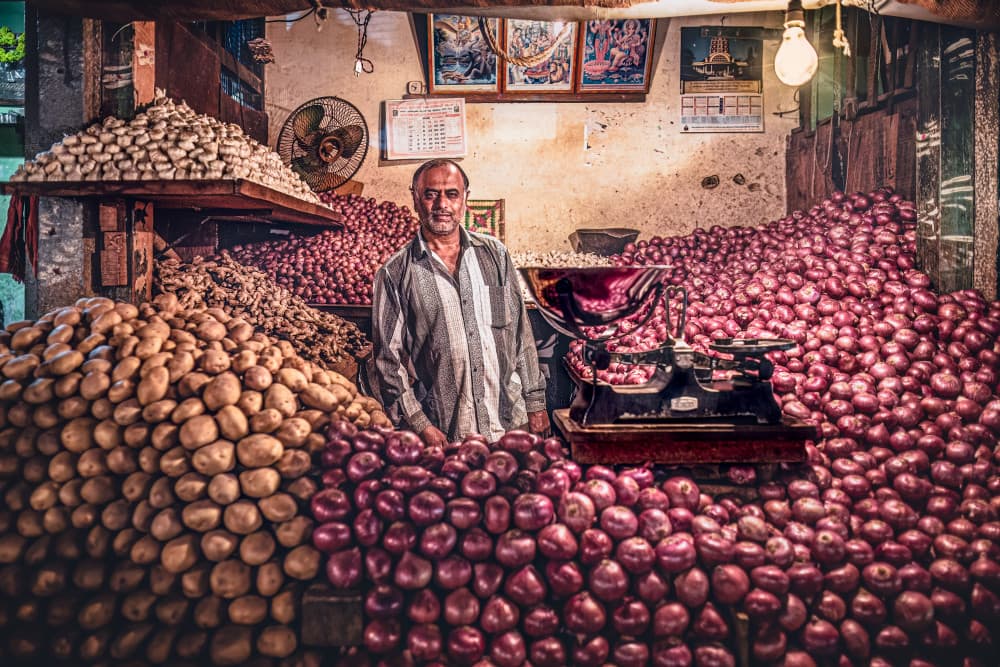 Indian Produce Vendor by Marco Tagliarino — canvas wall art