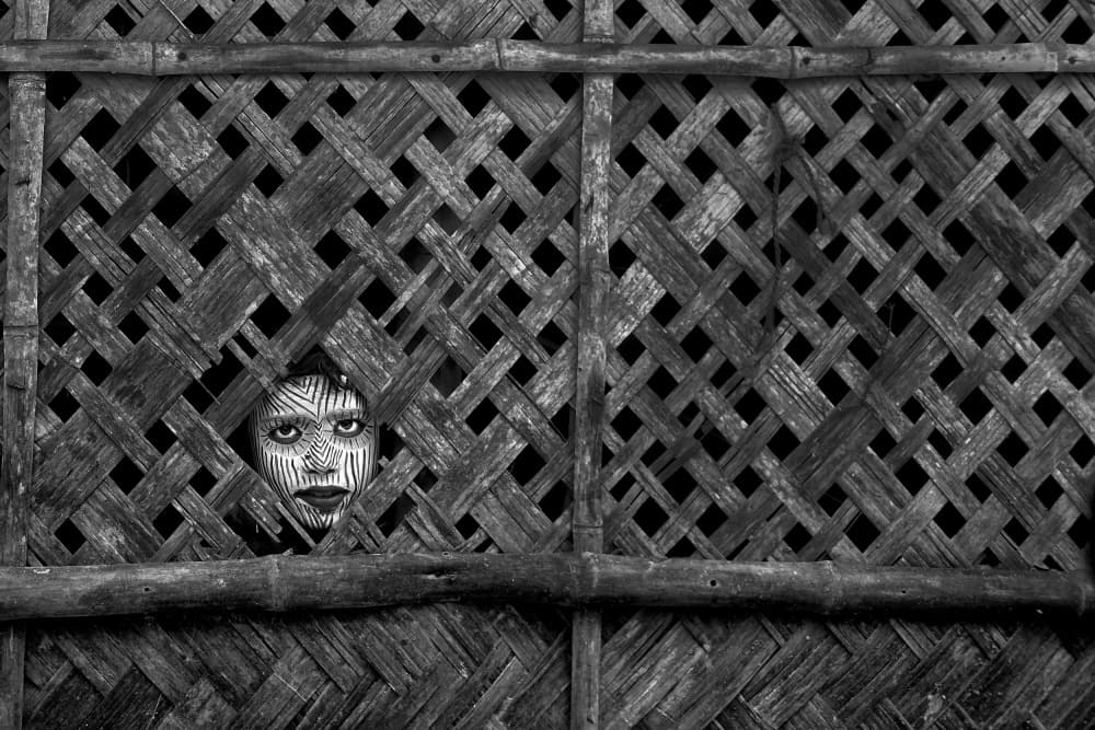 Tribal Face Peeking Through by Avishek Das — canvas wall art