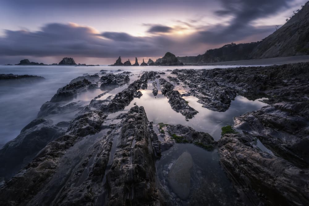 Twilight Ocean Rocks by Jorge Ruiz Dueso — canvas wall art