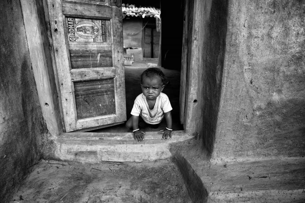 Little Child In Doorway by Shaibal Nandi — canvas wall art