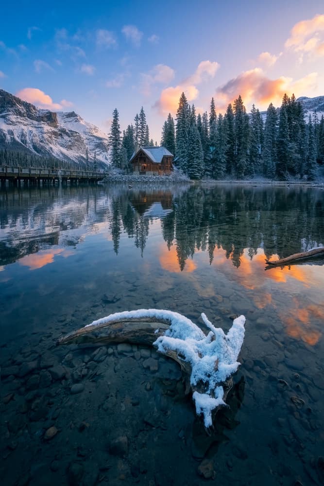 Snowy Mountain Cabin Reflection by Yongnan Li (李永男) — canvas wall art