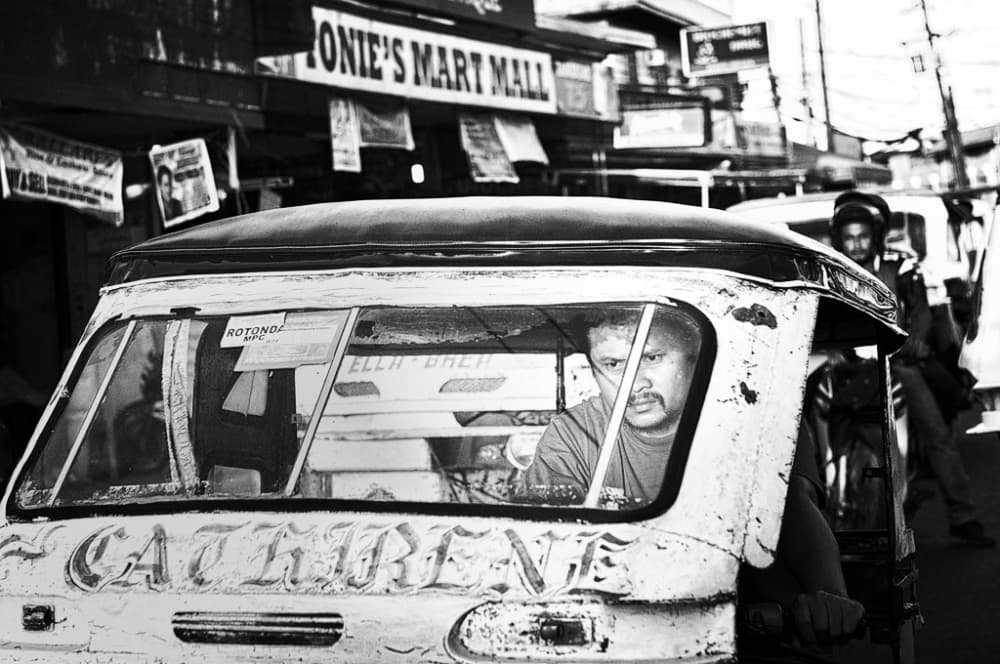 Man Driving Tricycle by Izidor Gasperlin — canvas wall art