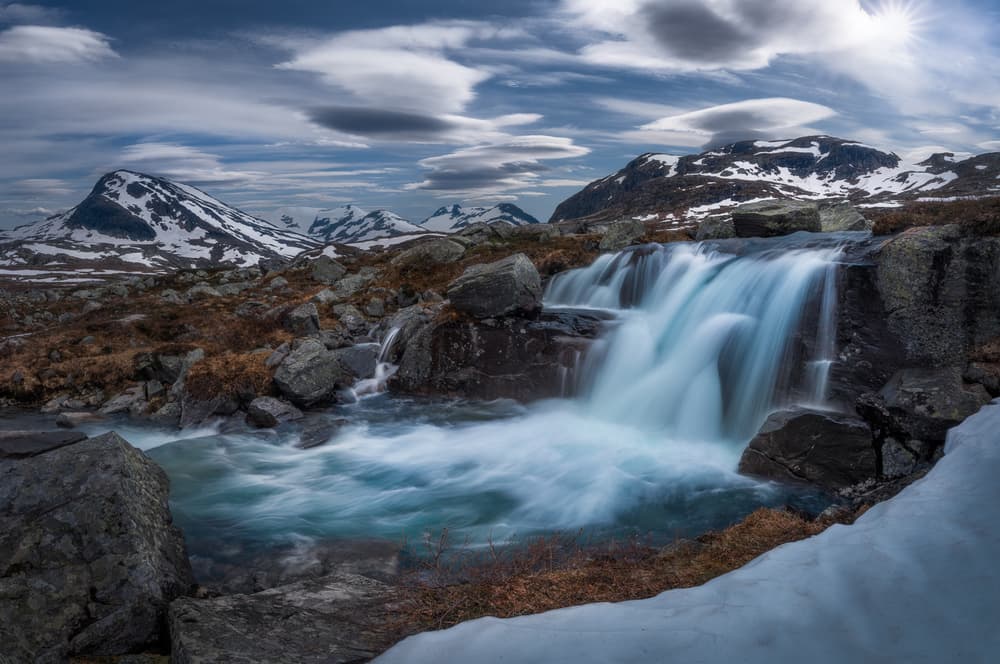 Snowy Peak Waterfall by Ole Henrik Skjelstad — canvas wall art
