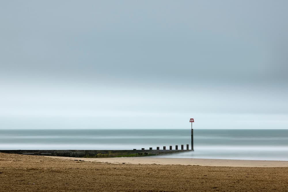Tranquil Beach Groyne by George Digalakis — canvas wall art