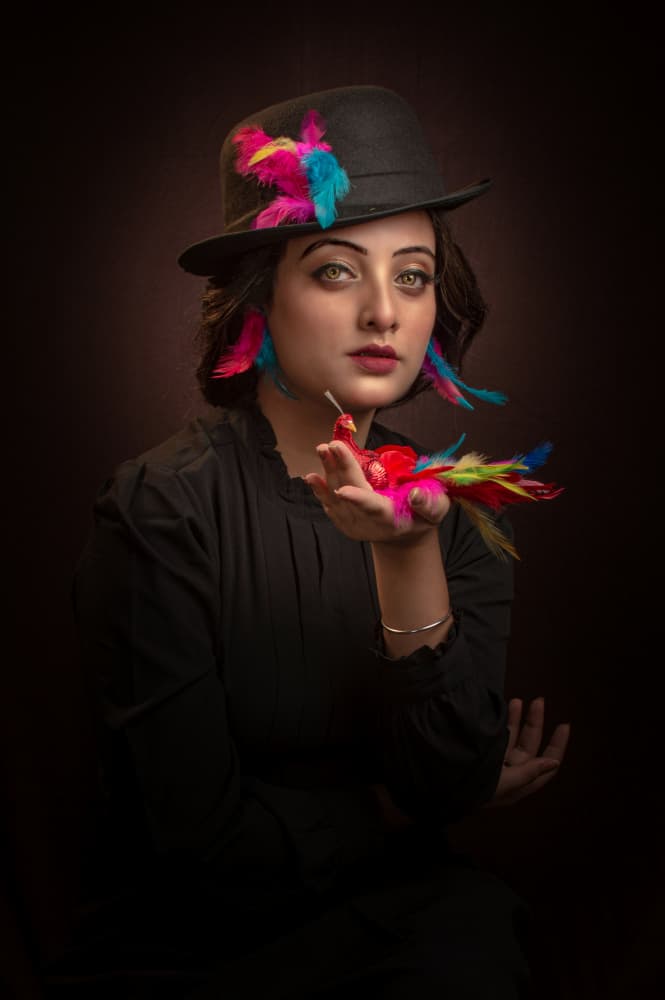 Woman With Colorful Feathers by DEBASISH CHATTOPADHYAY — canvas wall art